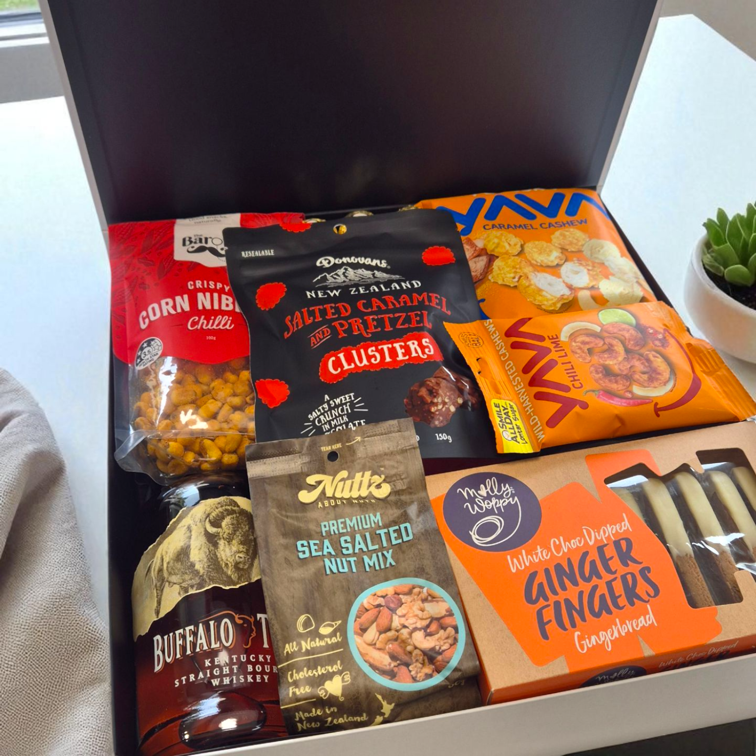 Bourbon gift hamper with snacks being received in Christchurch.