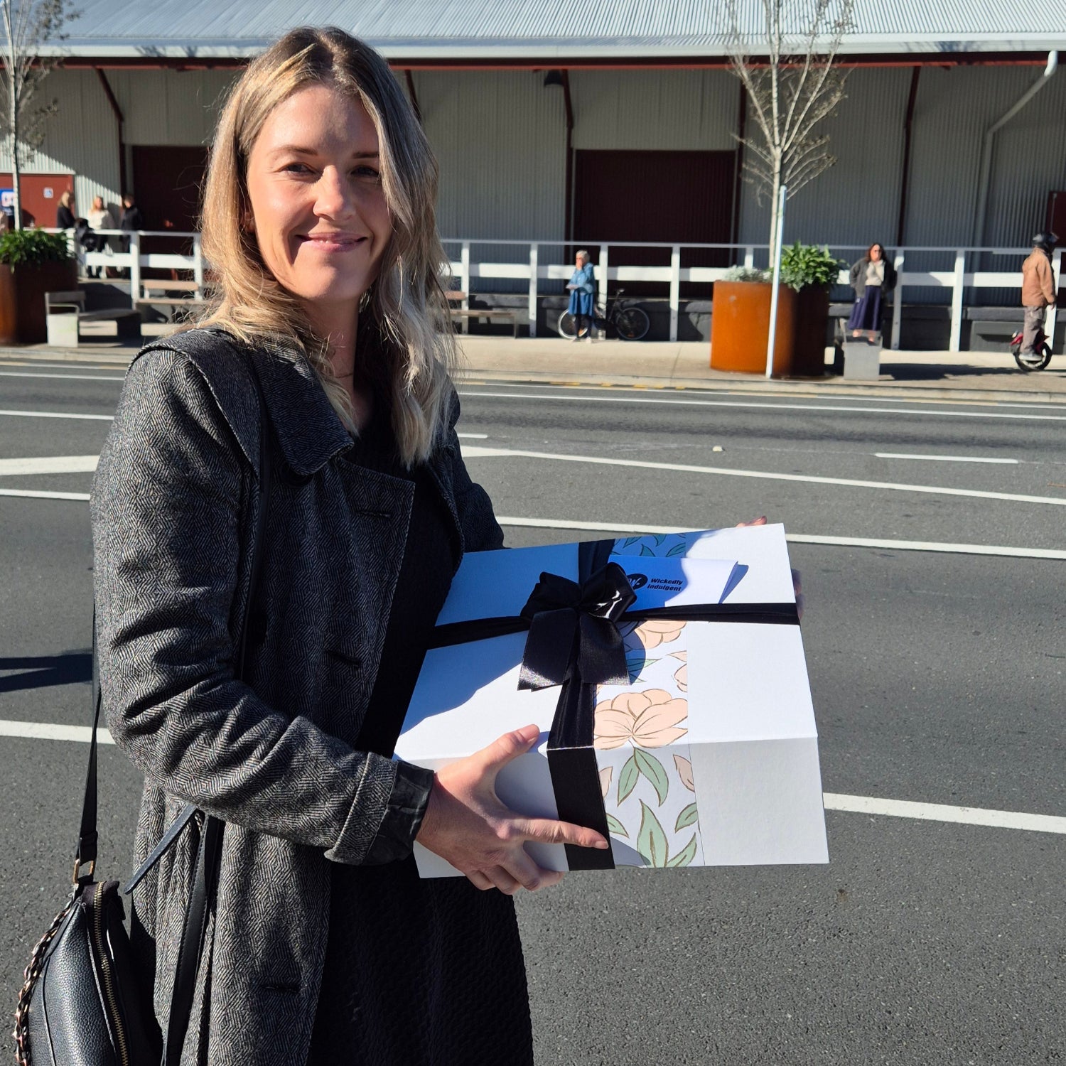 Lady holding a Wickedly Indulgent Gift Box in Christchurch