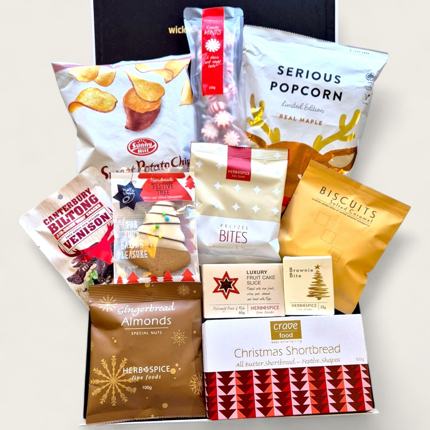 Christmas Calories Don’t Count Gift Hamper filled with festive sweet and savoury treats including gingerbread, popcorn, fudge, chocolate, and biltong.