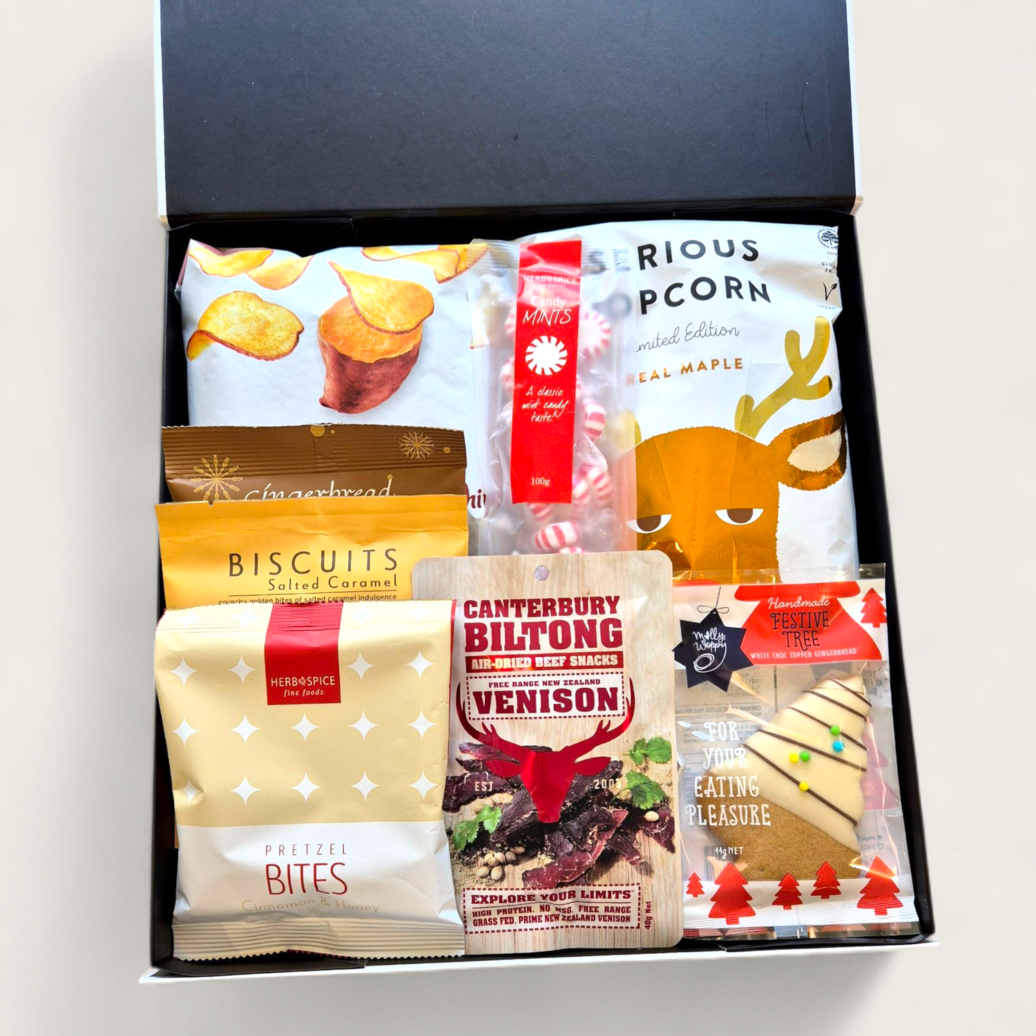 Christmas Calories Don’t Count Gift Hamper filled with festive sweet and savoury treats including gingerbread, popcorn, fudge, chocolate, and biltong.