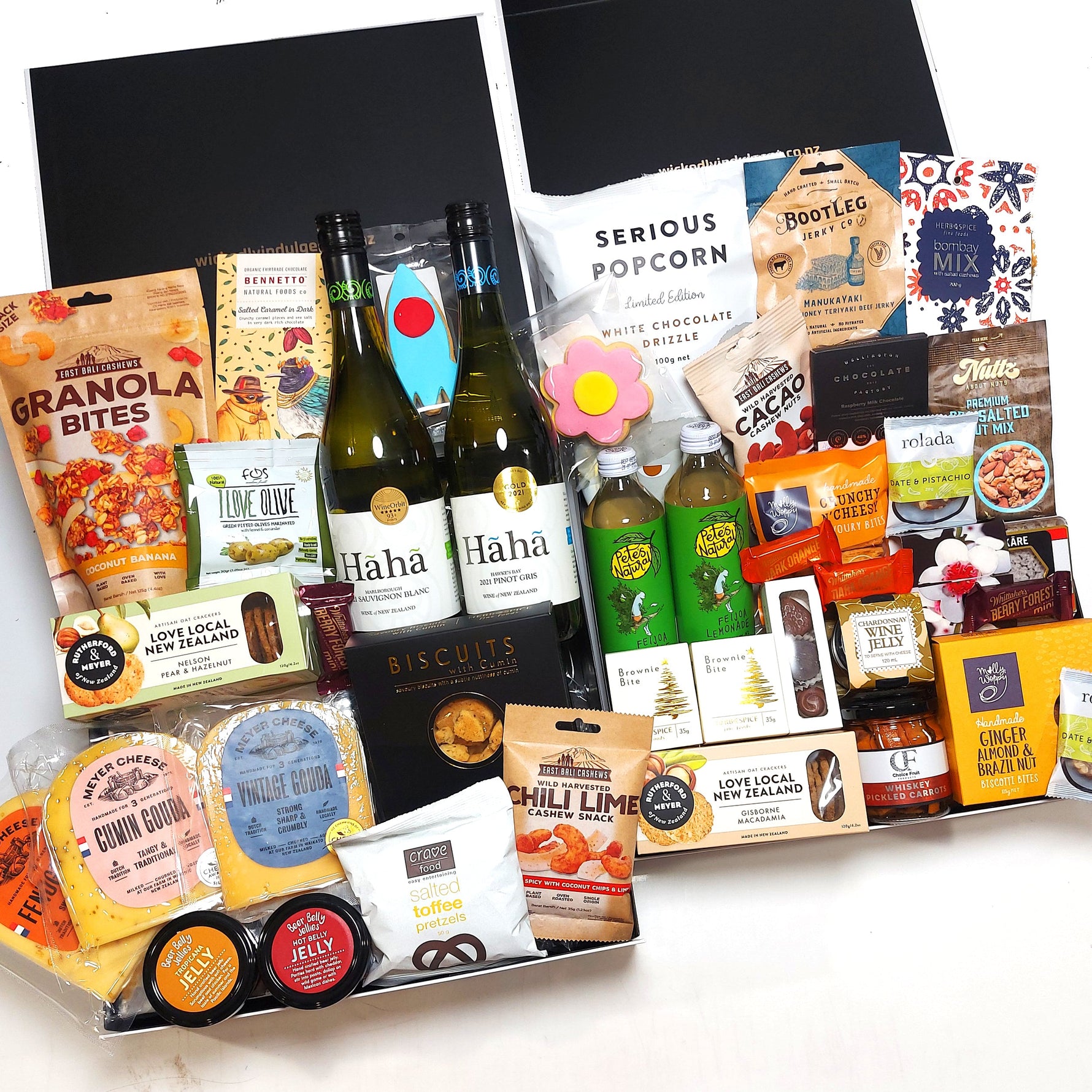 The Crowd Pleaser Hamper includes treats for everyone to savour, with a delicious range of wine, non alcoholic drinks, cheeses, condiments, nuts, chocolate & more.