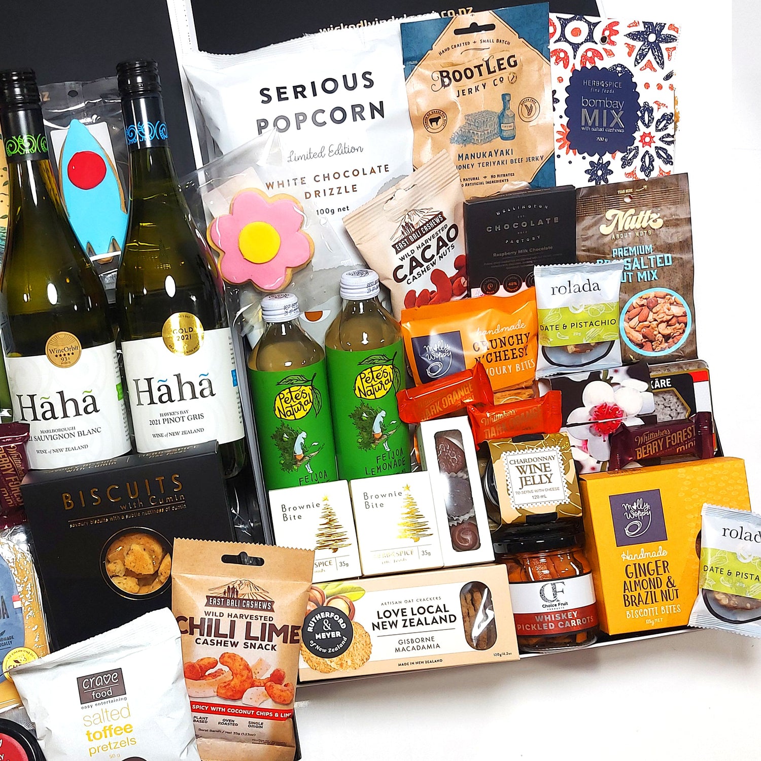 The Crowd Pleaser Hamper includes treats for everyone to savour, with a delicious range of wine, non alcoholic drinks, cheeses, condiments, nuts, chocolate & more.