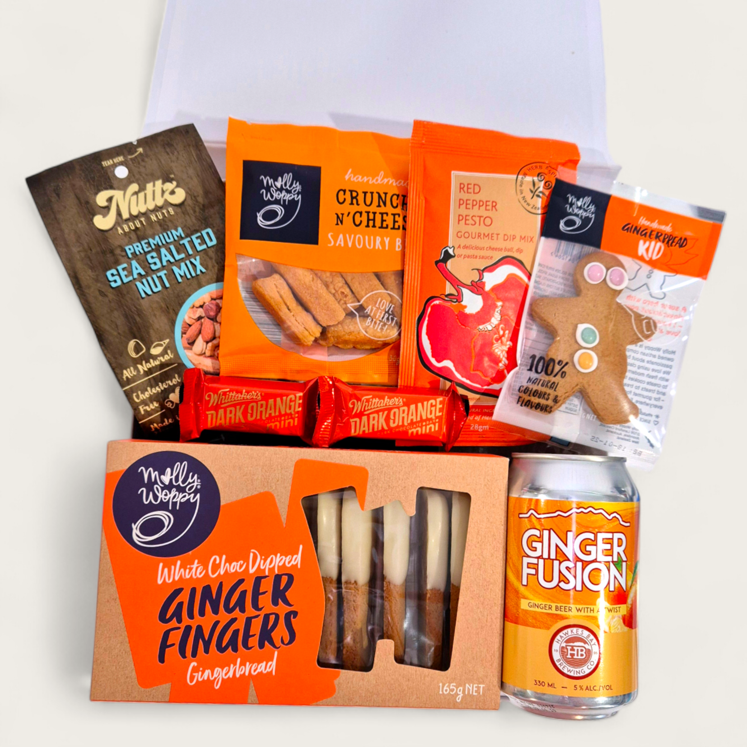 Ginger Ninja gift basket with alcoholic ginger beer, white choc ginfer fingers, gingerboy, nuts and dip all presented in a modern gift box.