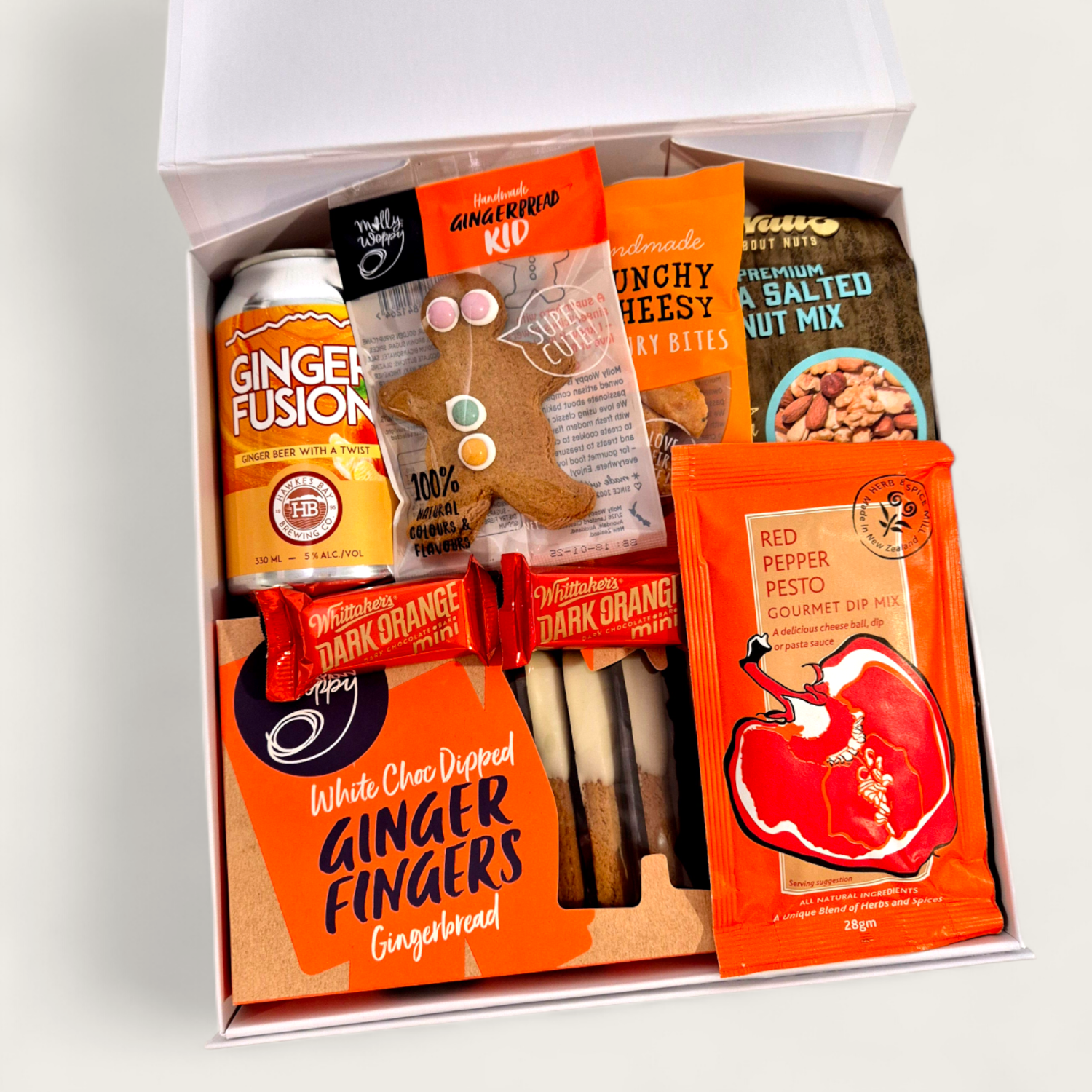 Ginger Ninja gift basket with alcoholic ginger beer, white choc ginfer fingers, gingerboy, nuts and dip all presented in a modern gift box.