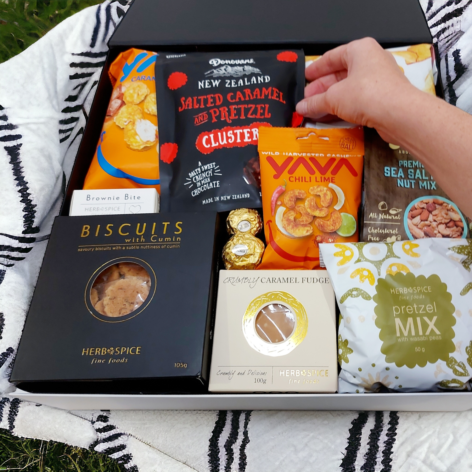 In a pickle gift basket. Sweet and savoury snacks presented in a modern gift box.