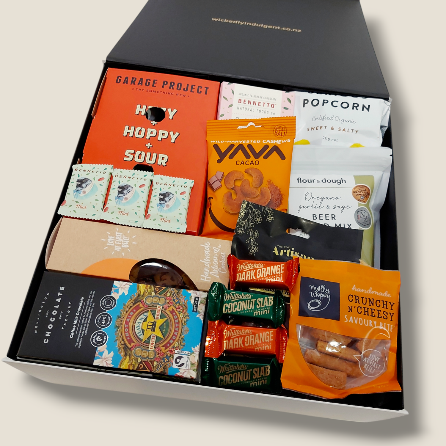 His & Hers wine & craft beer gift box with chocolate, biscuits, beer bread, chutney, cashews & more. Presented in a modern gift Box.