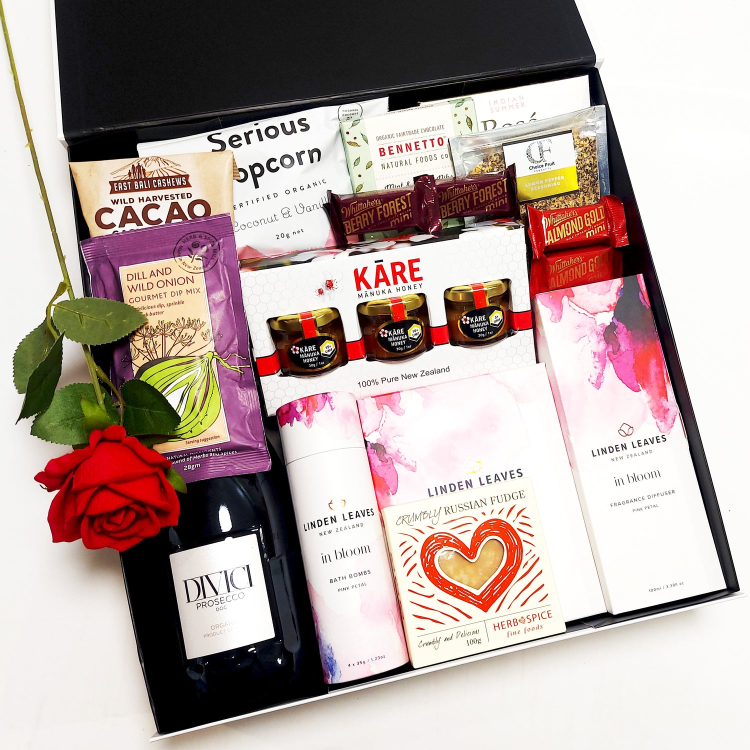 Romantic gift basket with prosecco, diffuser, bath bombs, honey & Chocolate. Presented in a modern gift box with an artificial red rose.