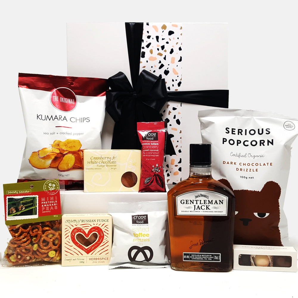 Alcoholic gift basket with Gentlemen Jack Whisky, chocolate, fudge, chips and more.