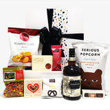 Alcoholic gift basket with Kraken Rum, chocolate, fudge, chips and more.