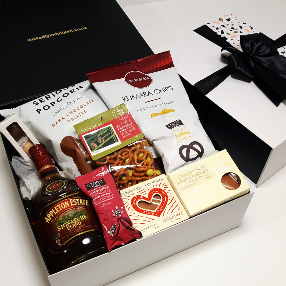 Alcoholic gift basket with Appletons rum, chocolate, fudge, chips and more.