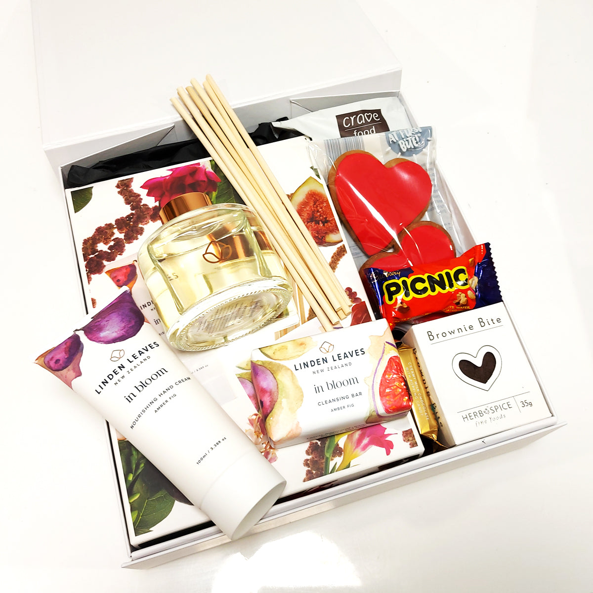 Pamper Me Gift Box with LInden Leaves diffuser, handcream & cleansing bar along with a few indulgent sweet treats.
