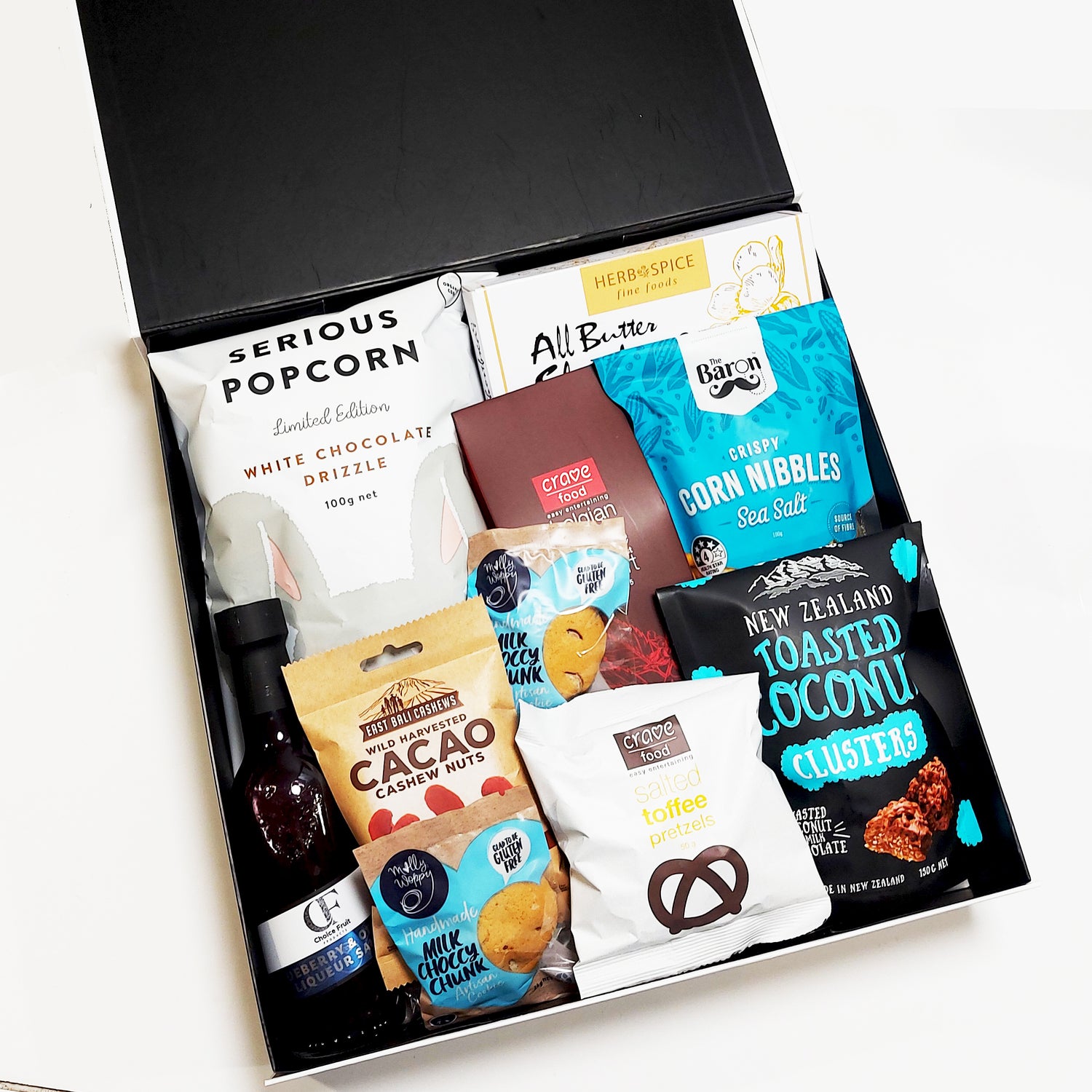 Suprise Sweets Gift Box with Blueberry & Orange Liqueuer Sauce, Mousse & Shortbread. Presented in a modern Gift Box.