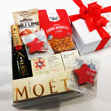 Mini Moet french champagne Christmas gift box with fruit cake, gingerbread, and other nibbles.