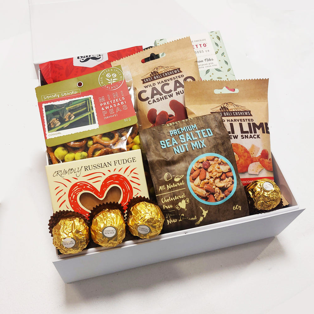 Han.gry gift basket with Nuts, Chocolate, Fudge & Pretzels presented in a modern Gift Box.