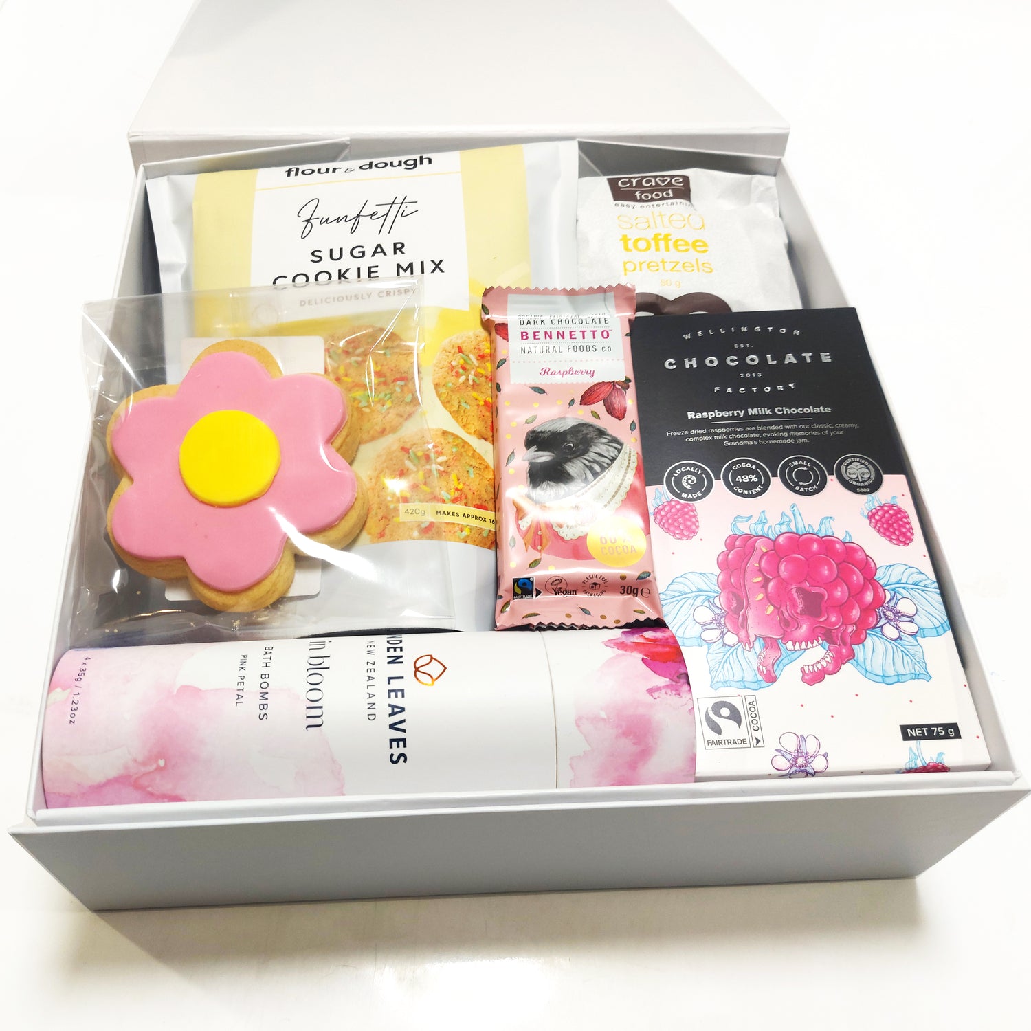 Me time gift basket with Linden Leaves bath bombs, Chocolate, sugar cookie mix & nibbles. Presented in a modern gift box.