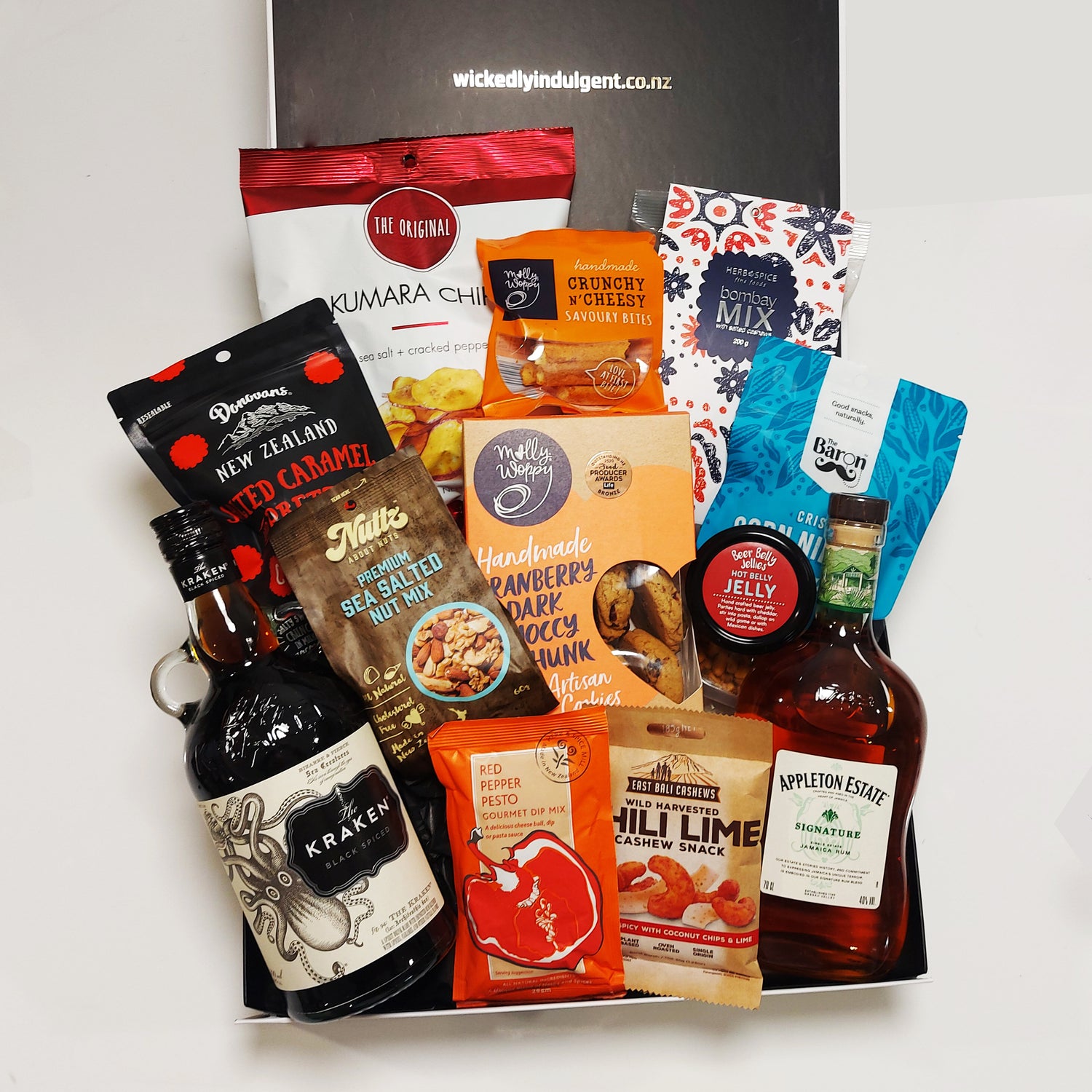 Rum gift hamper with Appletons & Kraken rum, chips, nuts, chocolate, beer infused jelly and more all presented in a modern gift box.