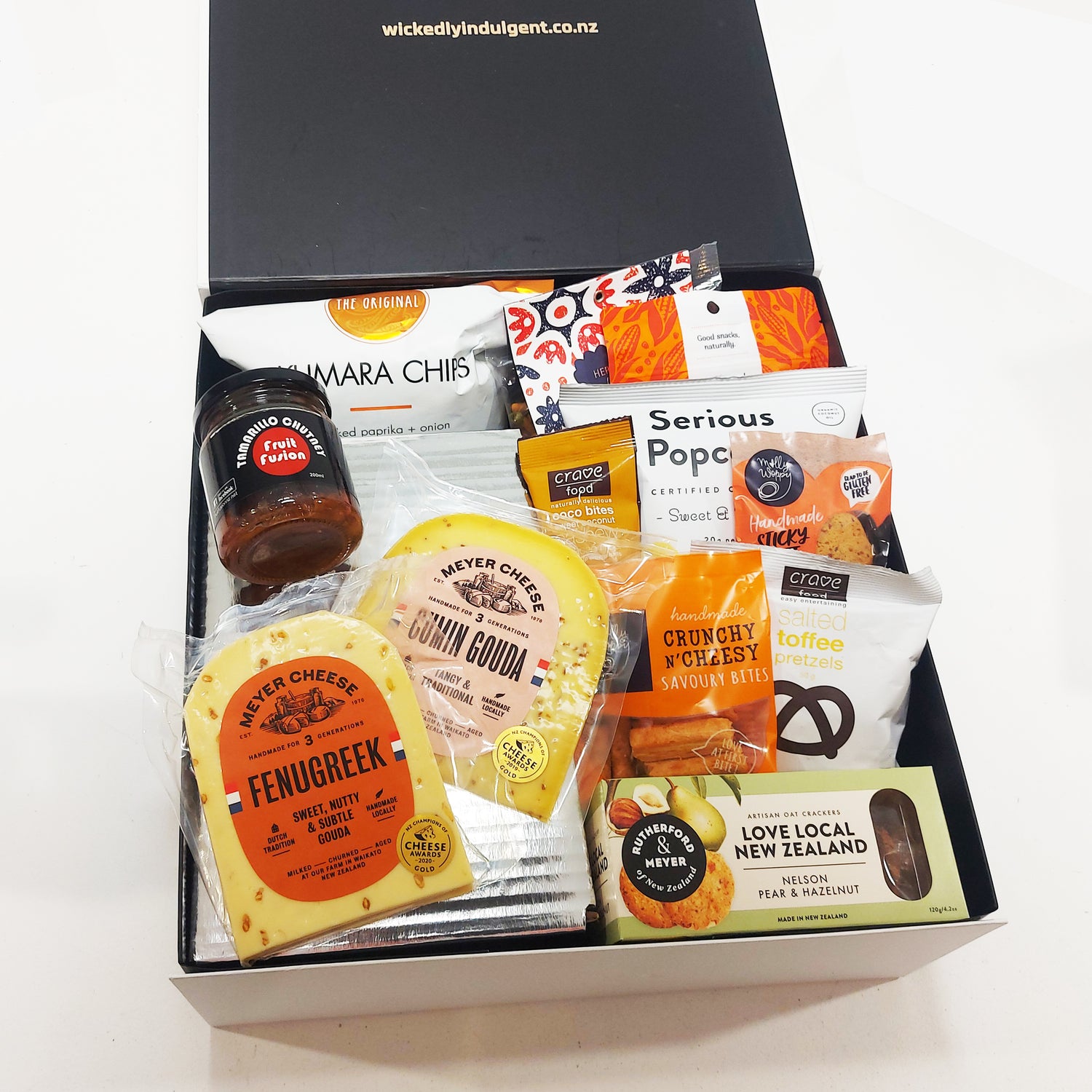 The grazing gift box with cheese, tamarillo chutney, chips, popcorn, pretzels & more.