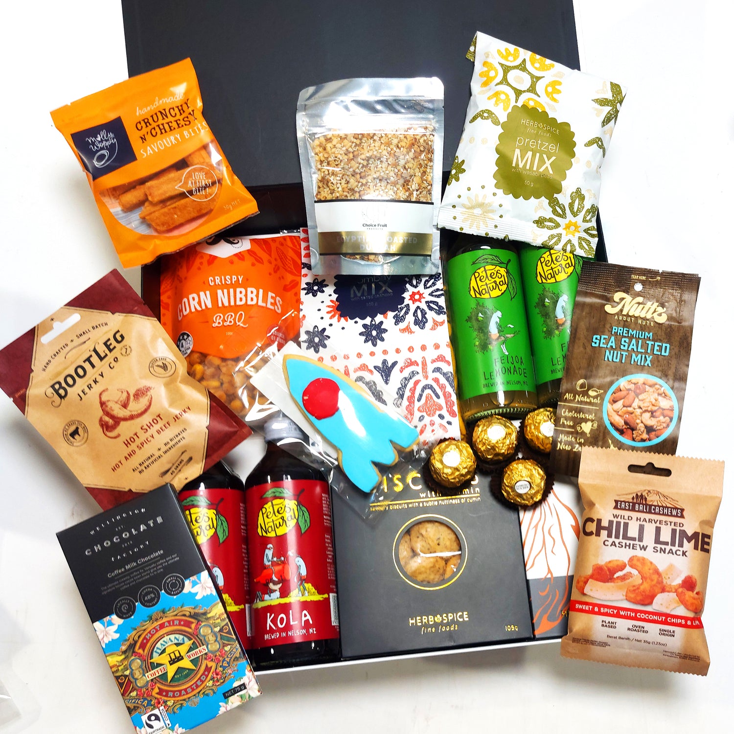 Non Alcoholic gift basket with drinks, chocolate, dukkah, jerky and more. Presented in a modern gift box.