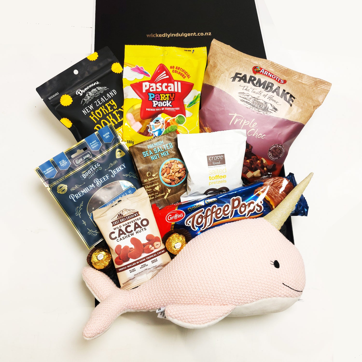 Underwater snacker gift basket with Lily & George Narwhal Soft Toy, Beef Jerky, Nuts, Biscuits & Nibbles. Presented in a modern Gift Box.