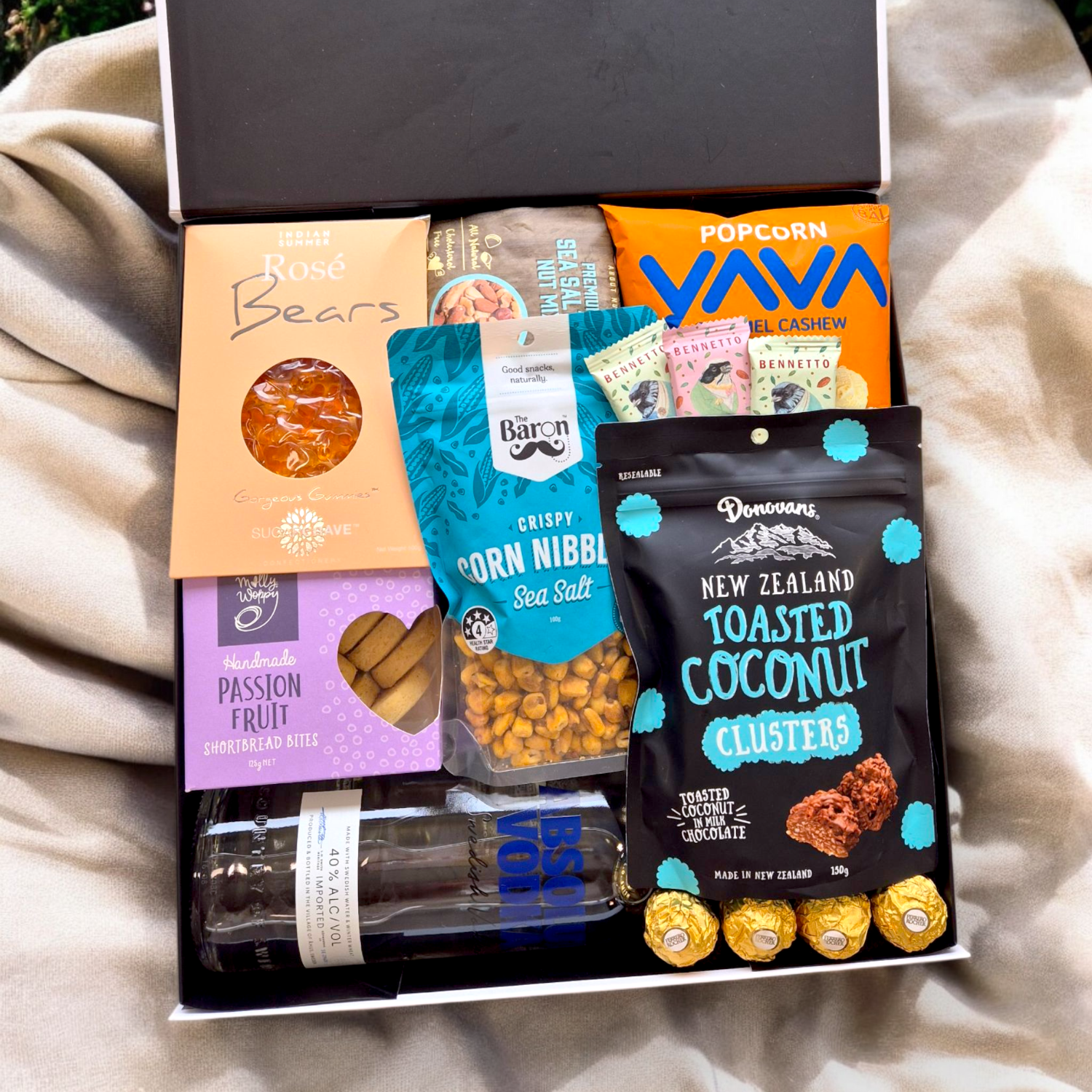 100% Chance of vodka- Absolut vodka gift basket with sweet and savoury gourmet nibbles all presented in a modern Gift Box.