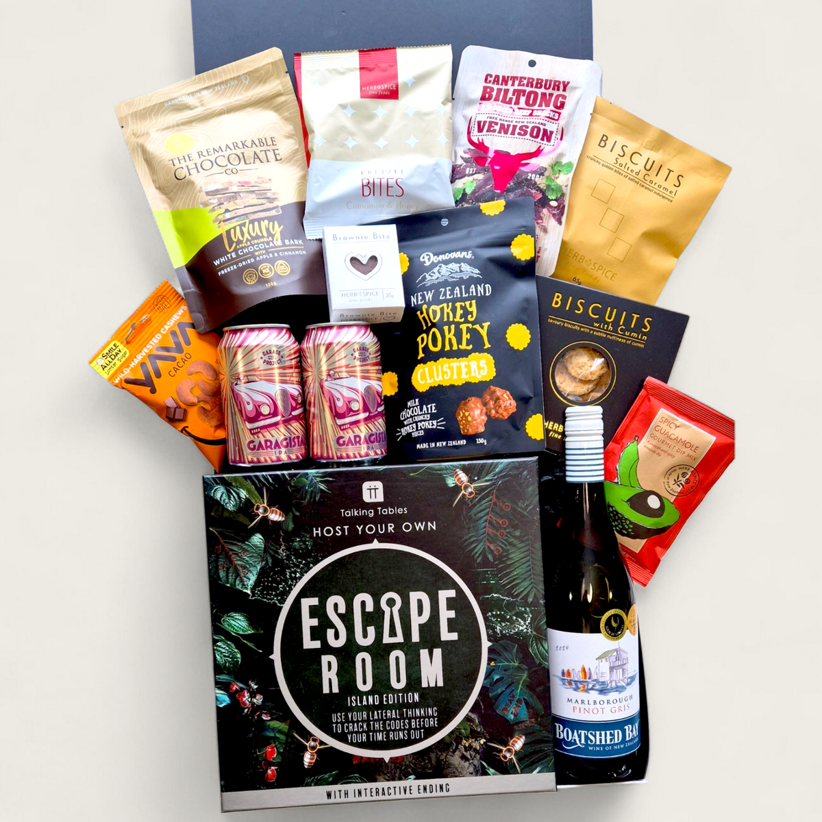Ales, Alibis & Accusations gift box with craft beer, snacks, and a Escape Room game, perfect for team or Friendmas gifting.