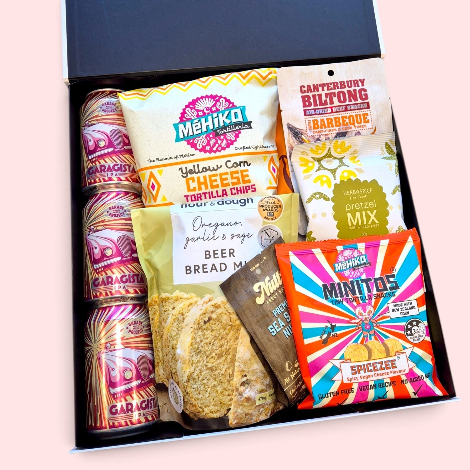 Beer gift hamper with Garage Project cans, beer bread mix, biltong, tortilla chips, nut mix, pretzels and savoury treats, in a modern gift box.