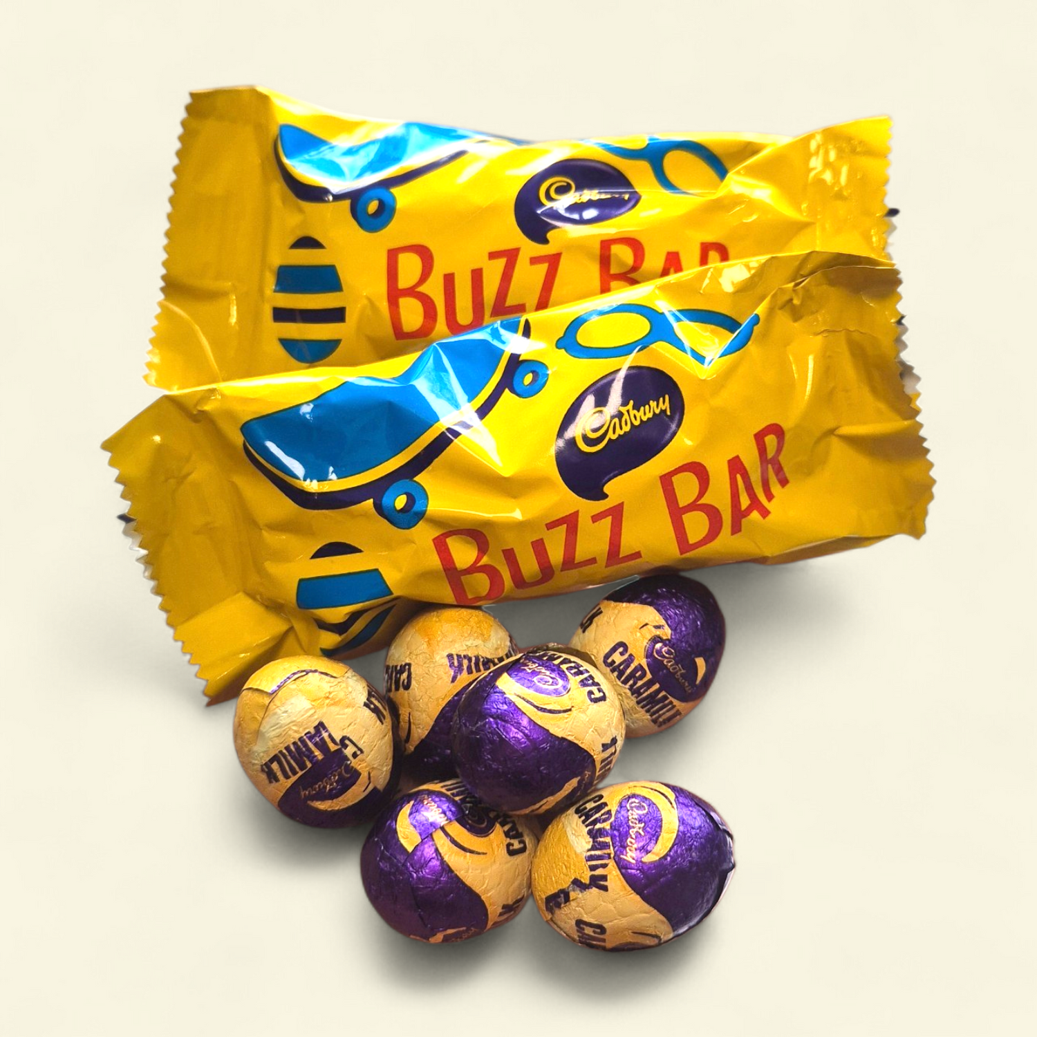 Two Cadbury Buzz Bar eggs and six Cadbury Mini Caramilk chocolate eggs, perfect Easter gift box add-on.