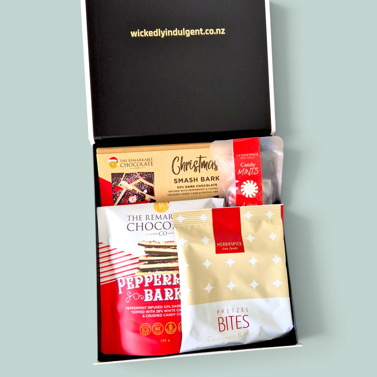 Candy Cane Wishes Christmas gift box with smash bark, brownie bites, pretzels and festive treats in a luxe black & white gift box.