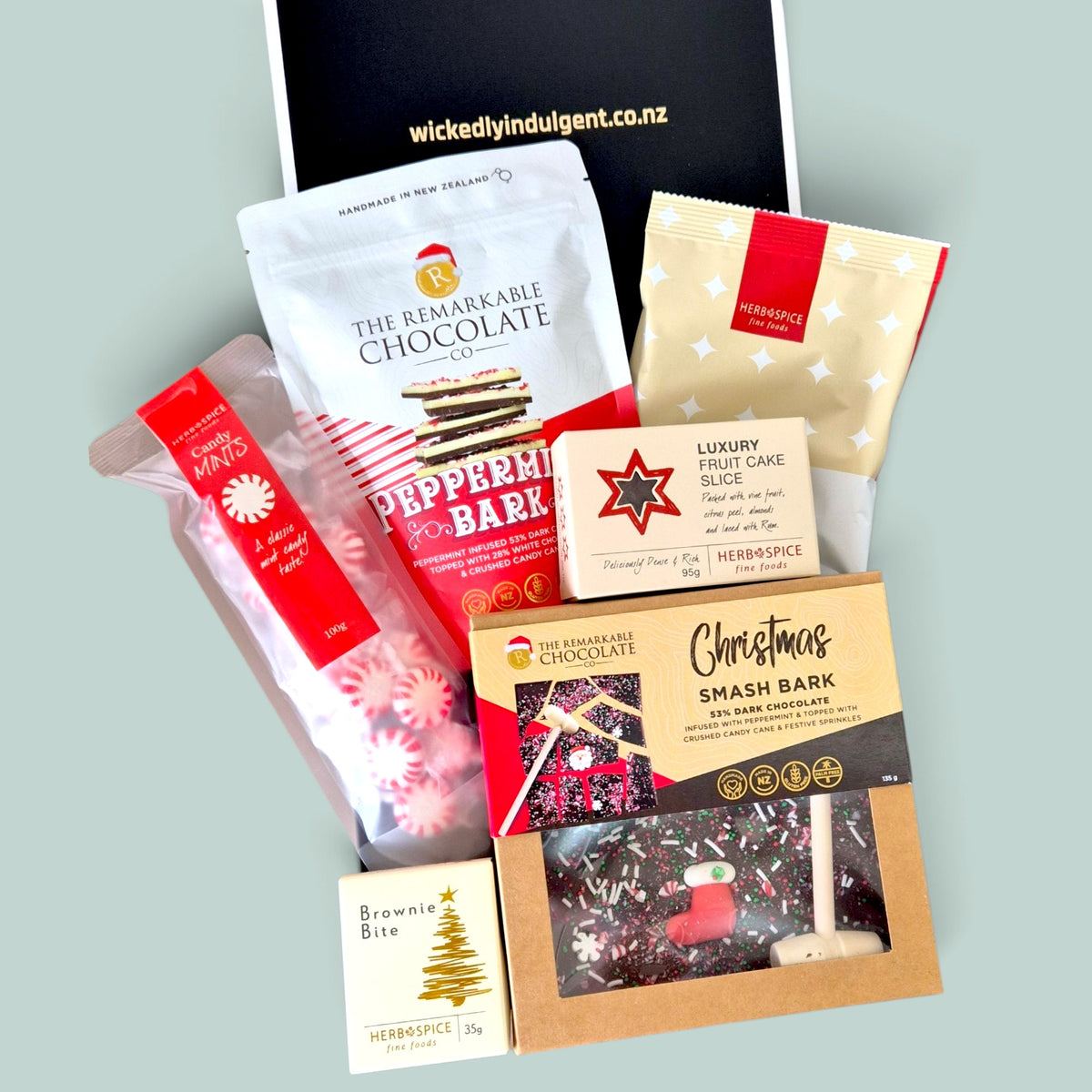 Candy Cane Wishes Christmas gift box with smash bark, brownie bites, pretzels and festive treats in a luxe black & white gift box.
