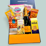 Luxury Champagne gift hamper with Veuve Clicquot, savoury snacks, biltong, chocolate, cheese crispies, cashews and treats, delivered NZ wide.