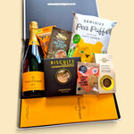 Champagne Is To Blame gift hamper with Veuve Clicquot Champagne, gourmet biscuits, fudge, pea puffs, nuts and cacao cashews.