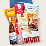 Festive Christmas gift box packed with wine, venison biltong, serious popcorn, luxury shortbread, and holiday snacks worth unwrapping.