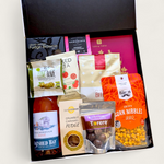 Gourmet wine hamper with board game and snacks, a fun and unique gift idea for wine lovers or corporate teams.