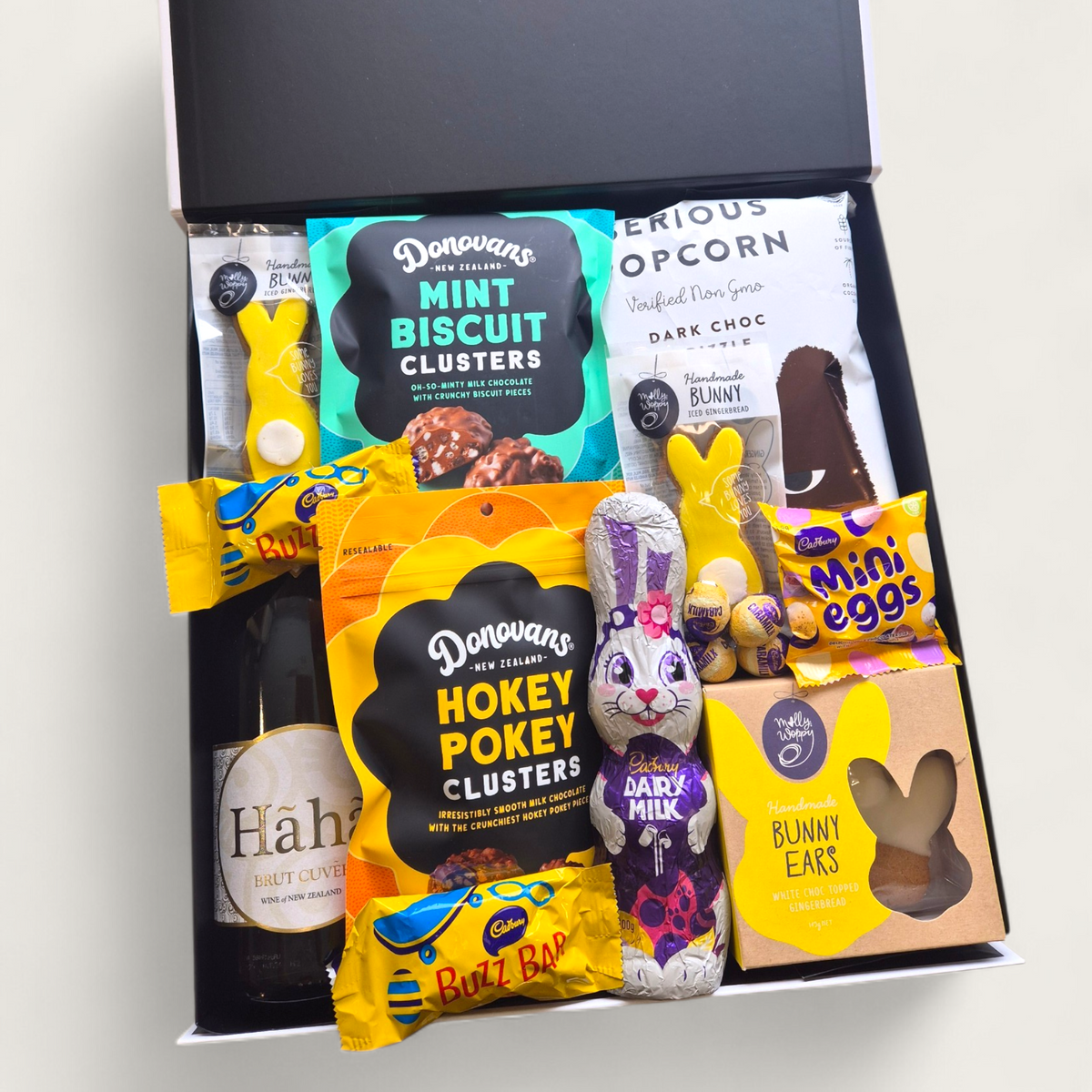 Easter gift box with sparkling wine, chocolate bunny, hokey pokey clusters and gourmet snacks