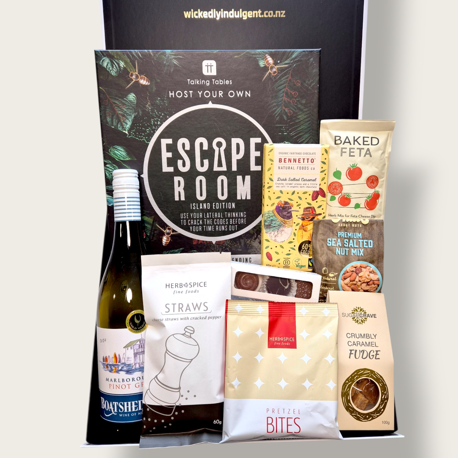 Sip, Snack & Sleuth gift box with gourmet treats, wine, and an escape room game, perfect for Christmas or housewarming gifting.