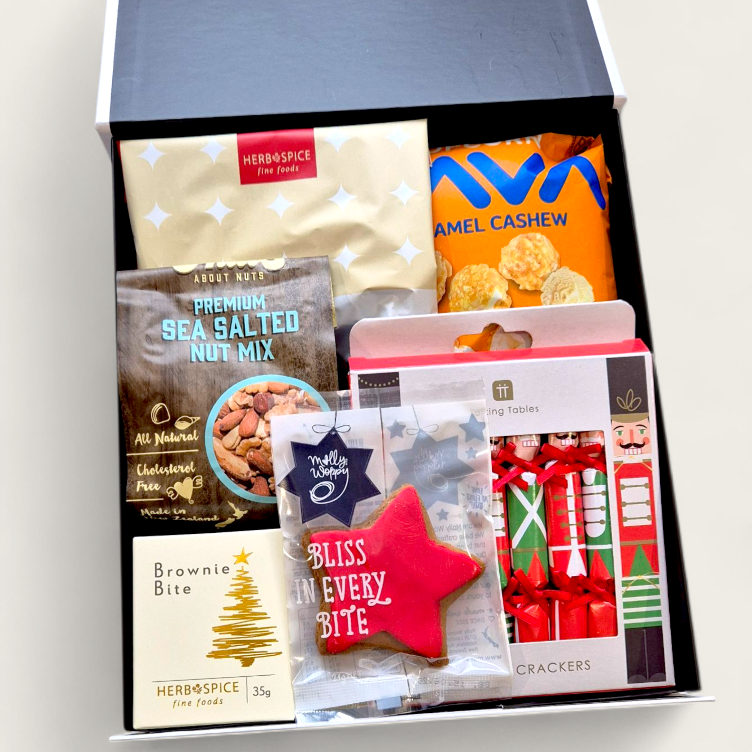 Wickedly Indulgent Festive Fix Hamper filled with holiday snacks, Christmas crackers, and gourmet goodies.