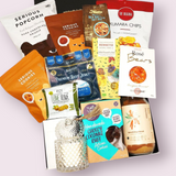 Gluten & Dairy Free Gift Box with candle, cake mix, cookies, jerky, chocolate & more. Presented in a modern gift box.