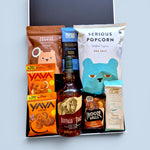 Gluten-free dairy-free gift hamper NZ containing Buffalo Trace Kentucky 
Straight Bourbon Whiskey, Serious Cookies Double Chocolate, Serious 
Popcorn Sea Salt, Solomon's Gold Dark Nib 75% Cacao vegan chocolate, 
Solomon's Gold Dark Mylk vegan chocolate, Yava Chilli Lime wild-harvested 
cashews, Yava Cacao cashews, and Frooze Balls Choc Hazelnut — 
Wickedly Indulgent you choose the booze gift box