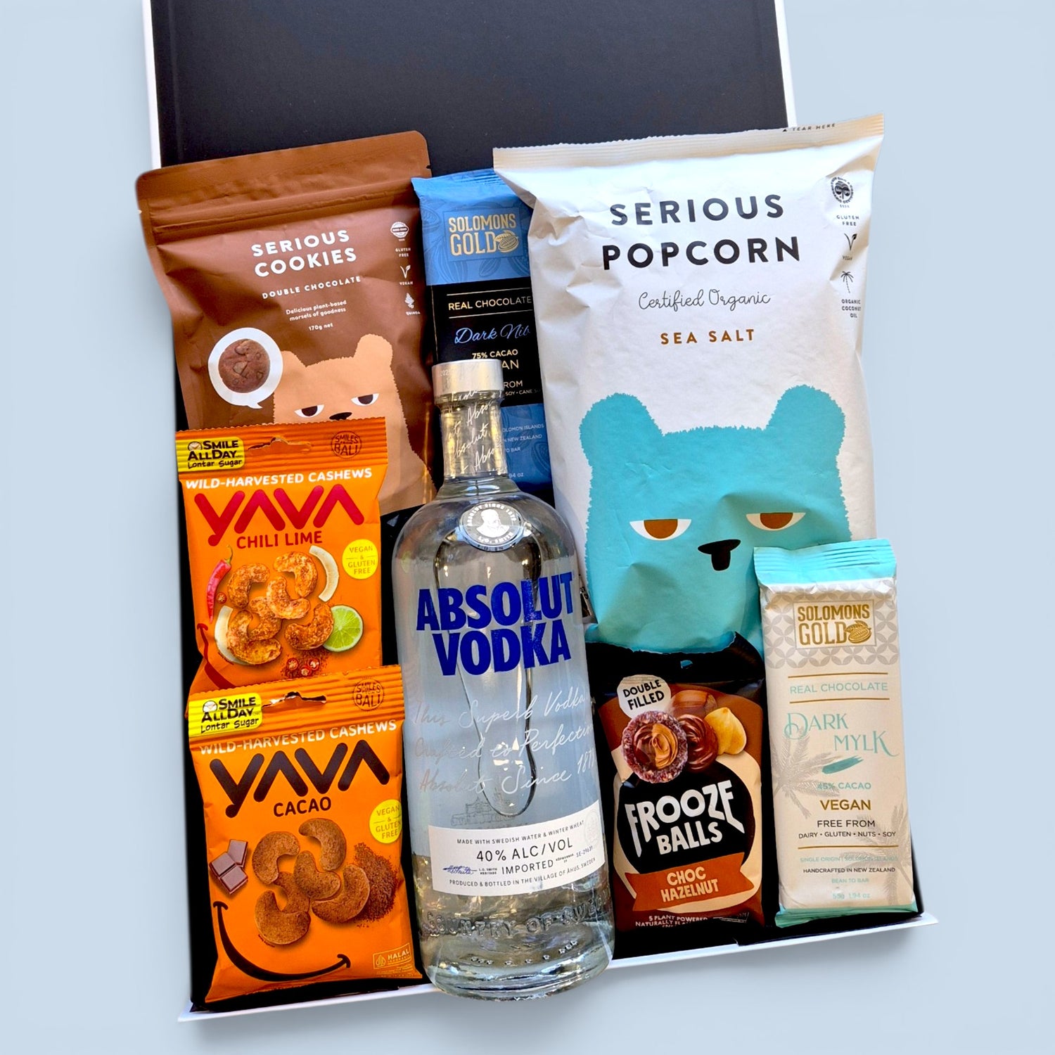 Gluten free and dairy free gift hamper with vodka, chocolate, popcorn, cookies, cashews and sweet treats in a premium Wickedly Indulgent gift box.