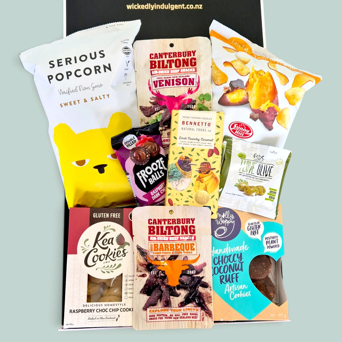 Get In My Belly gourmet gift box packed with sweet and savoury treats, including venison biltong, popcorn, chocolate, cookies, cashews and snacks.