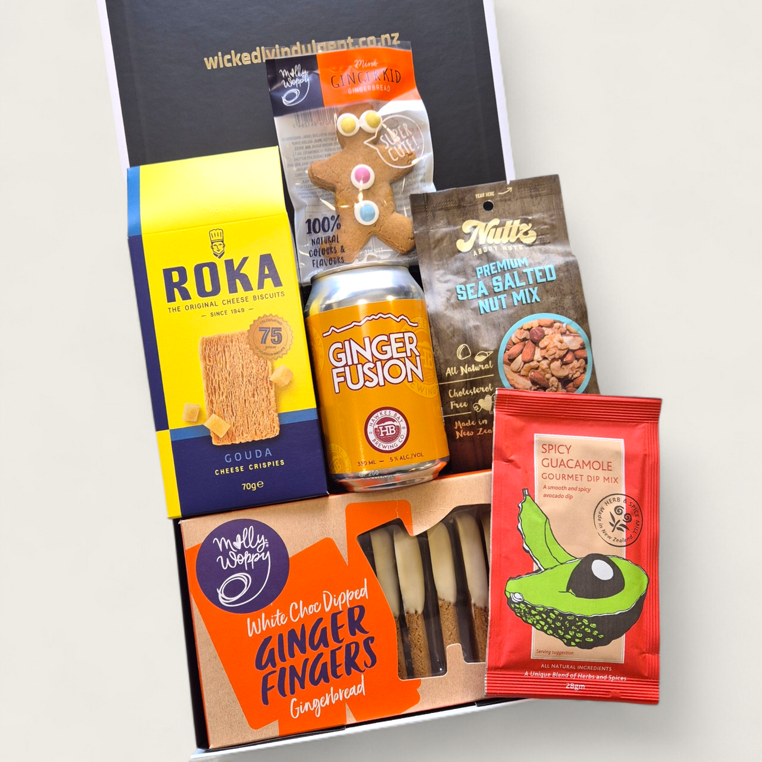 Ginger Ninja gift basket with alcoholic ginger beer, white choc ginger fingers, gingerboy, nuts and dip all presented in a modern gift box.