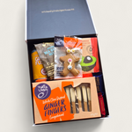 Ginger Ninja gift basket with alcoholic ginger beer, white choc ginger fingers, gingerboy, nuts and dip all presented in a modern gift box.