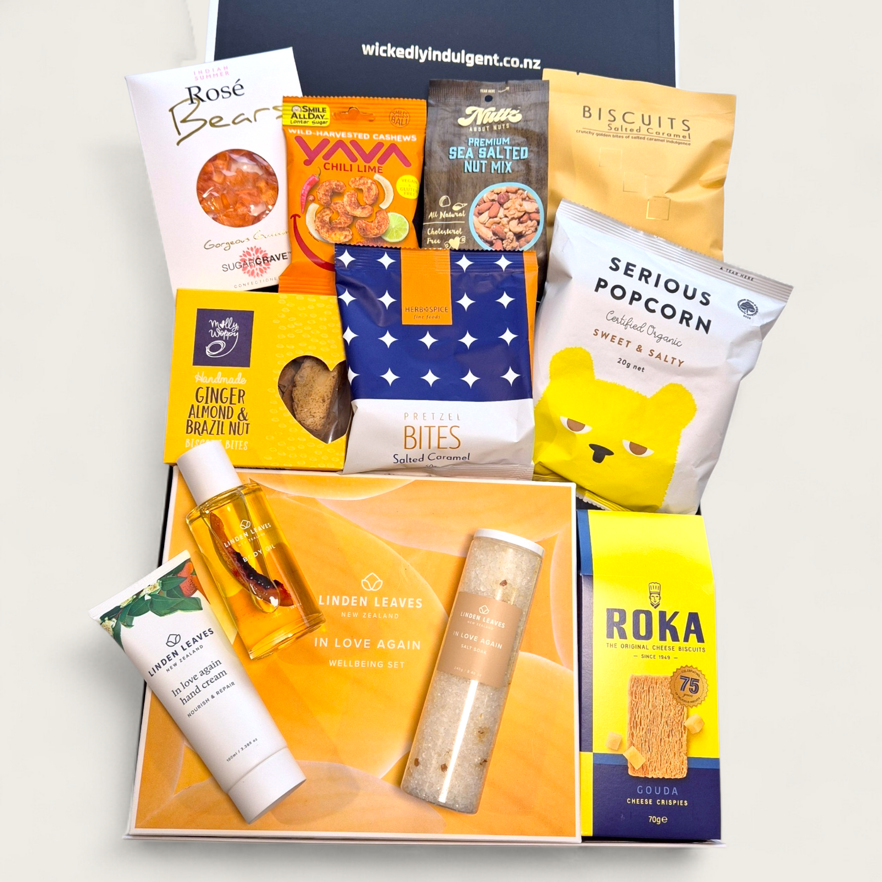 Snack and self care gift hamper with popcorn, nuts, chocolates and Linden Leaves products, beautifully packaged gift box