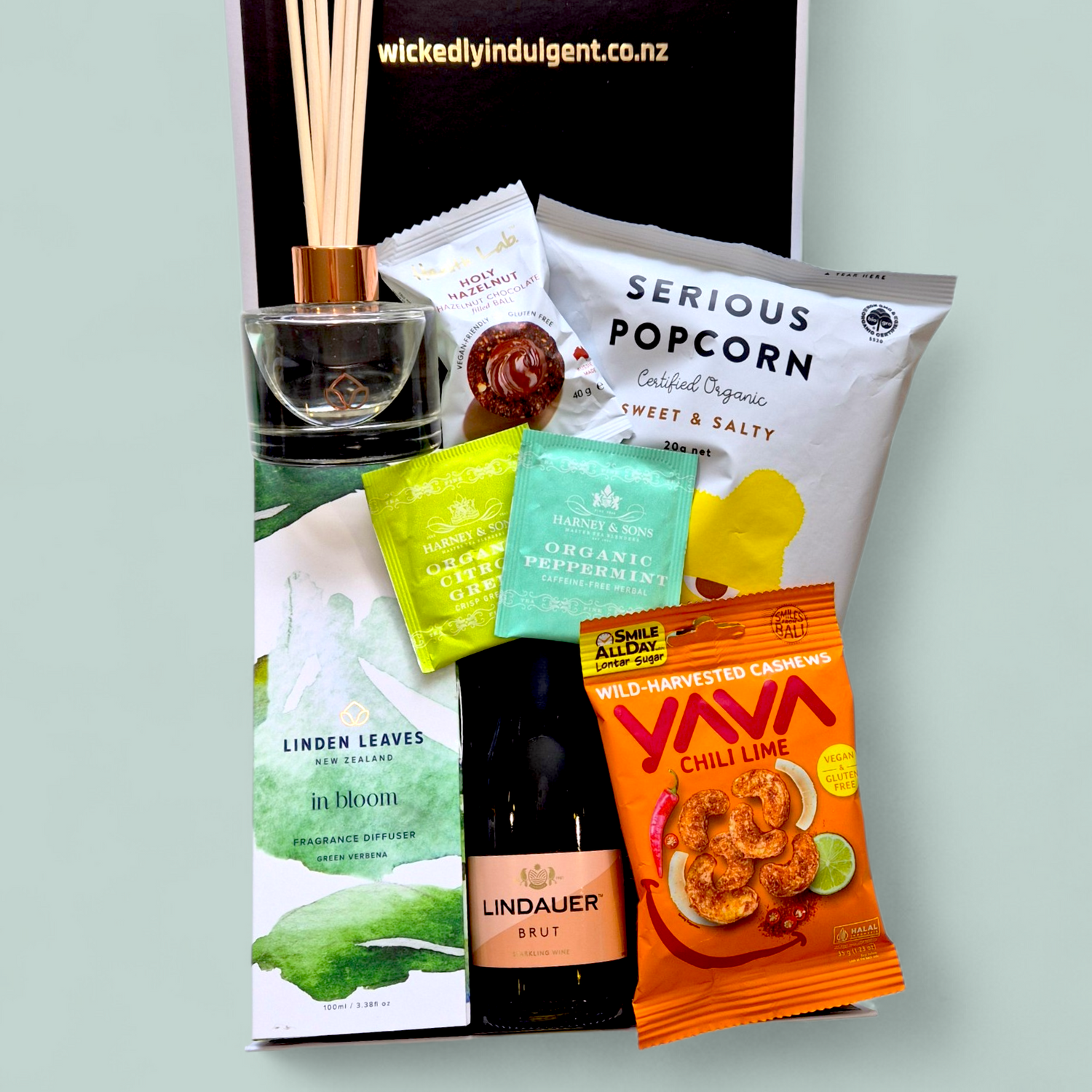 Gluten and dairy free gift box NZ with snacks, tea, diffuser and sparkling wine hamper