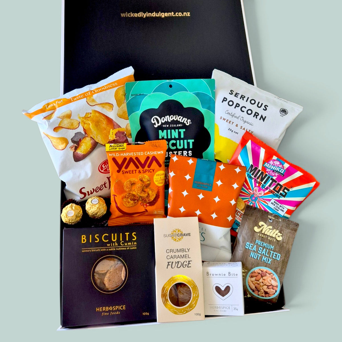 In a Pickle gourmet gift hamper with sweet and savoury snacks, chocolate, nuts, biscuits and fudge, beautifully presented in a Wickedly Indulgent gift box.