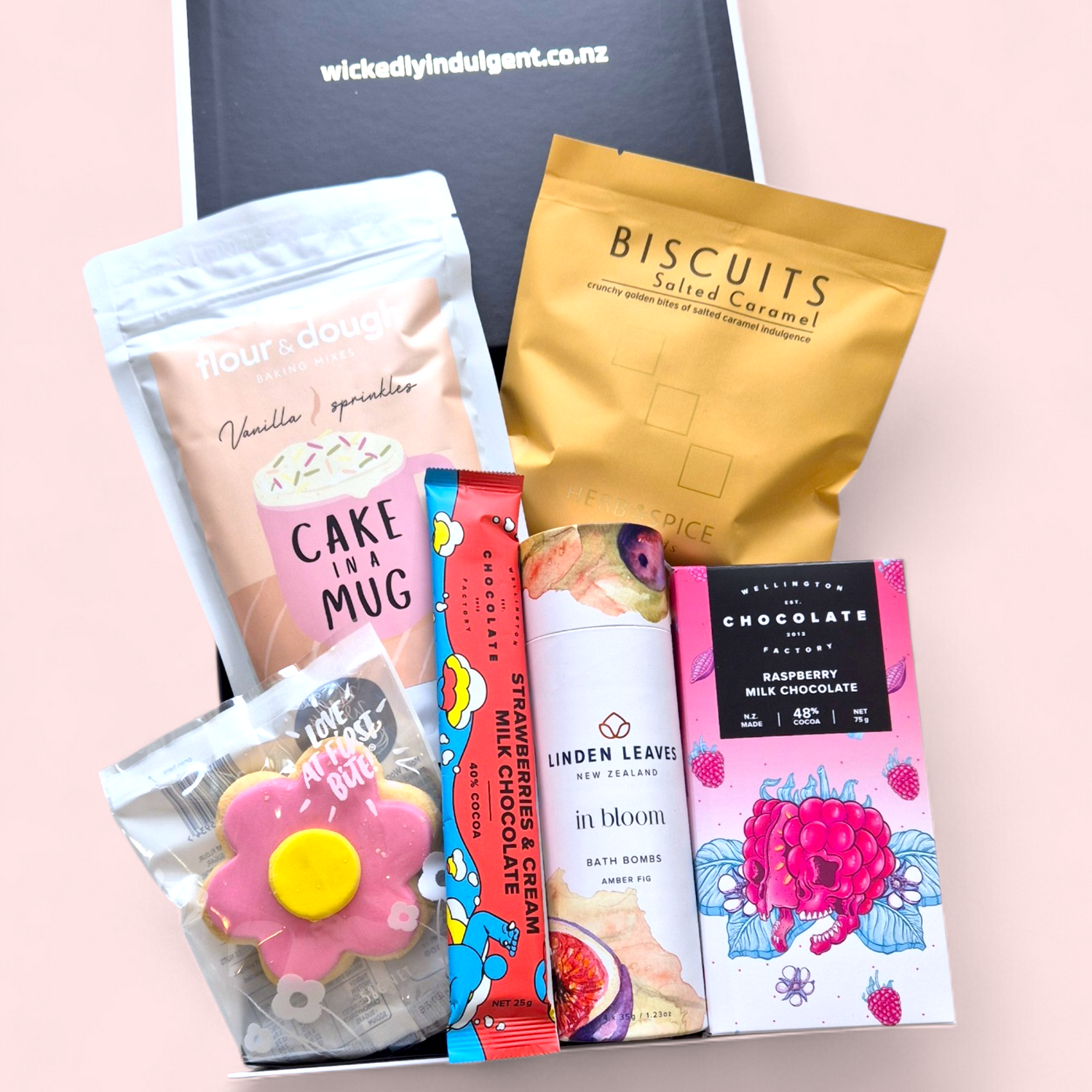 Pamper gift box NZ with bath bomb, cake in a mug, chocolate and sweet treats