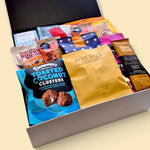 Non-alcoholic gourmet gift hamper presented in a Wickedly Indulgent gift box, packed with chocolates, snacks, cookies and savoury treats.