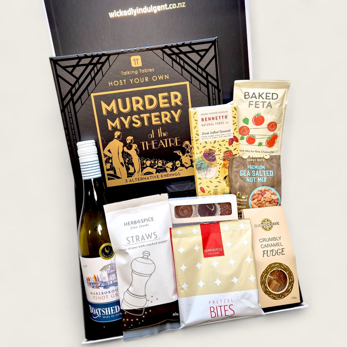 Wickedly Indulgent mystery game gift box featuring NZ-made treats and wine — fun, delicious, and effortlessly giftable.