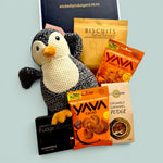 Penguin Snuggles baby gift box with soft penguin plush, salted caramel biscuits, fudge brownie, caramel fudge and cashew treats.