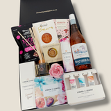 Superwoman pamper gift hamper with room diffuser, bath bombs, handcreams, preserved rose and sweet treats. Presented in a modern gift box.